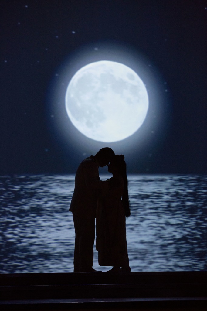 Pinkerton (Adam Diegel) and Cio-Cio-San (Dina Kuznetsova) kiss under the full moon. Photo by Jeff Roffman.